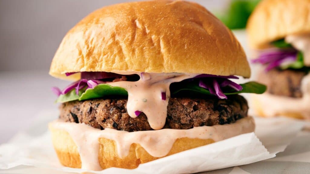 Black bean burgers with red cabbage slaw.