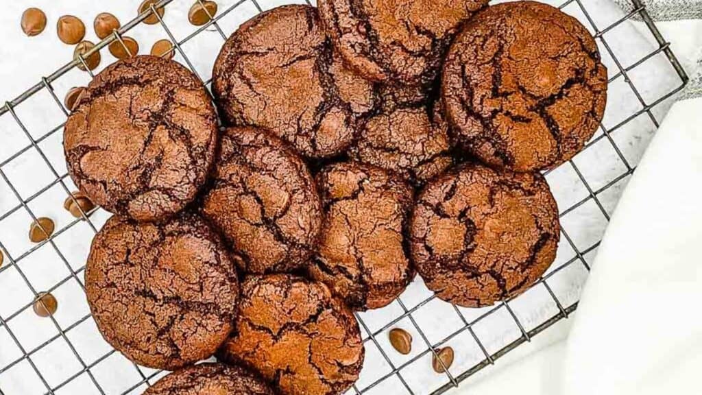 Chocolate cookies on a cooling rack.