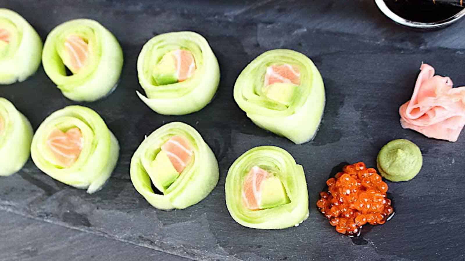 Keto Friendly Sushi Rolls served on a black board. 