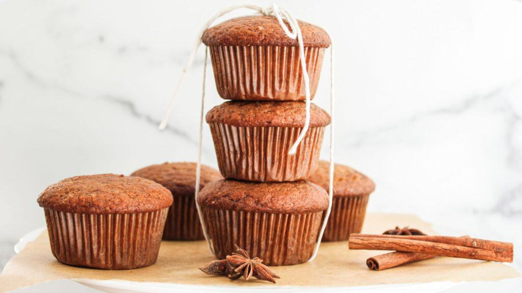 A stack of cinnamon muffins on a plate.