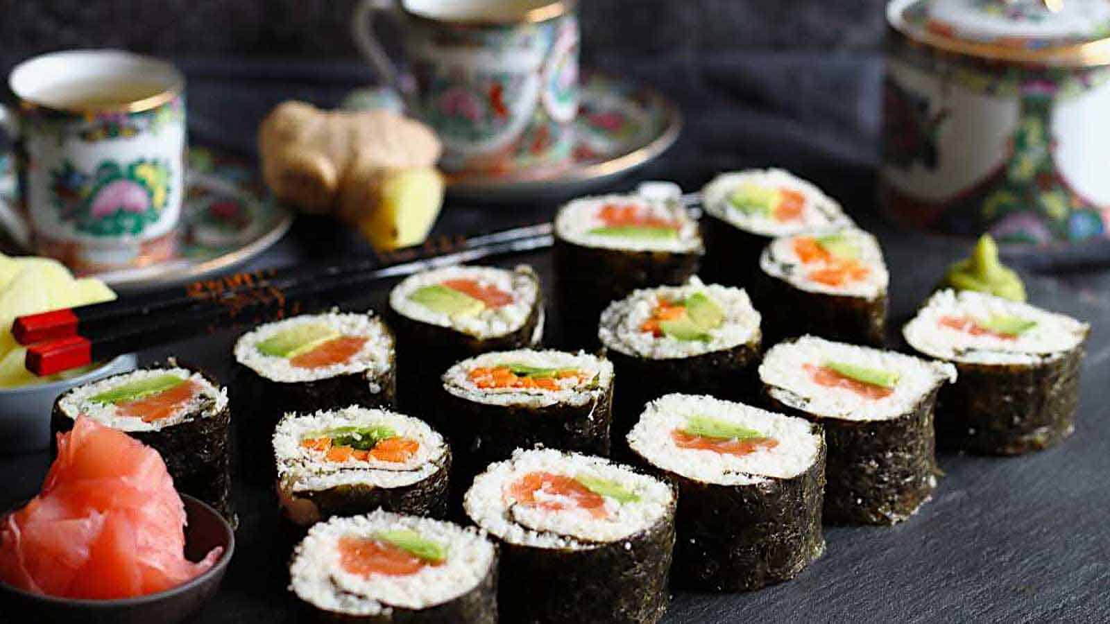 Keto Friendly Sushi Rolls served on a black board. 