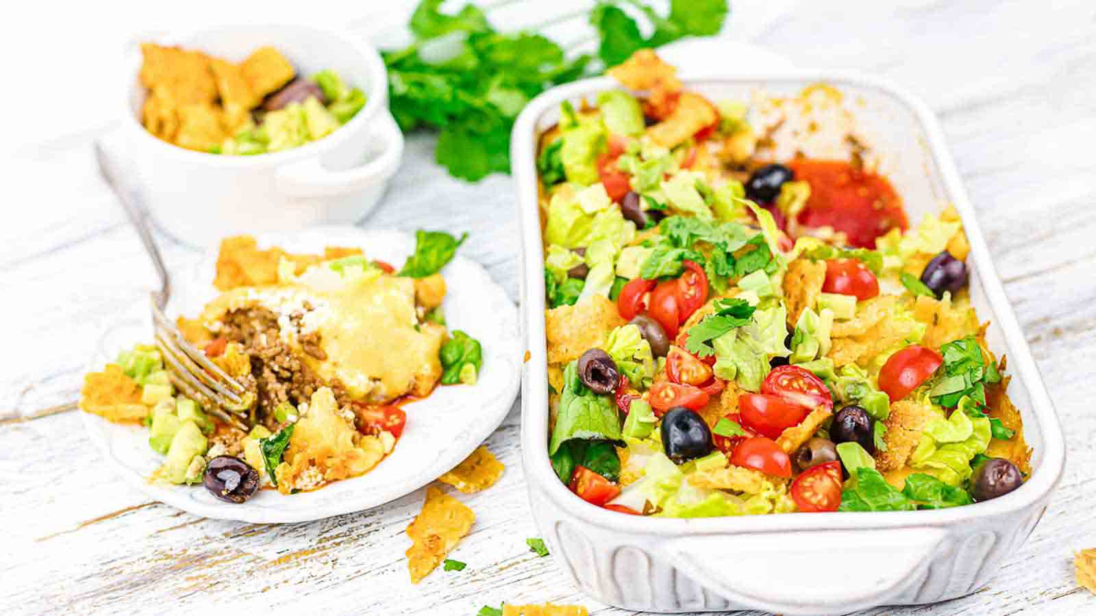 A picture of Keto Taco Casserole in silver dish ready to serve on a white background.