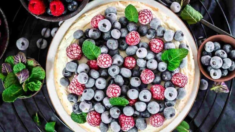 Instant Pot Keto Cheesecake with frozen berries on top.