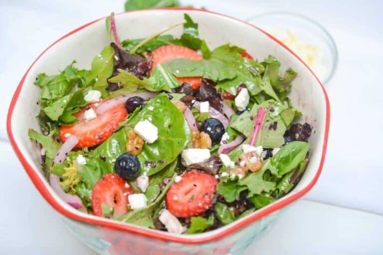 A refreshing lunch idea worth taking a break for: salad with strawberries, blueberries, and feta cheese.