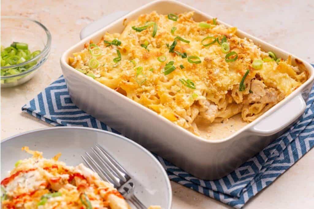 A dish with chicken and pasta in it.