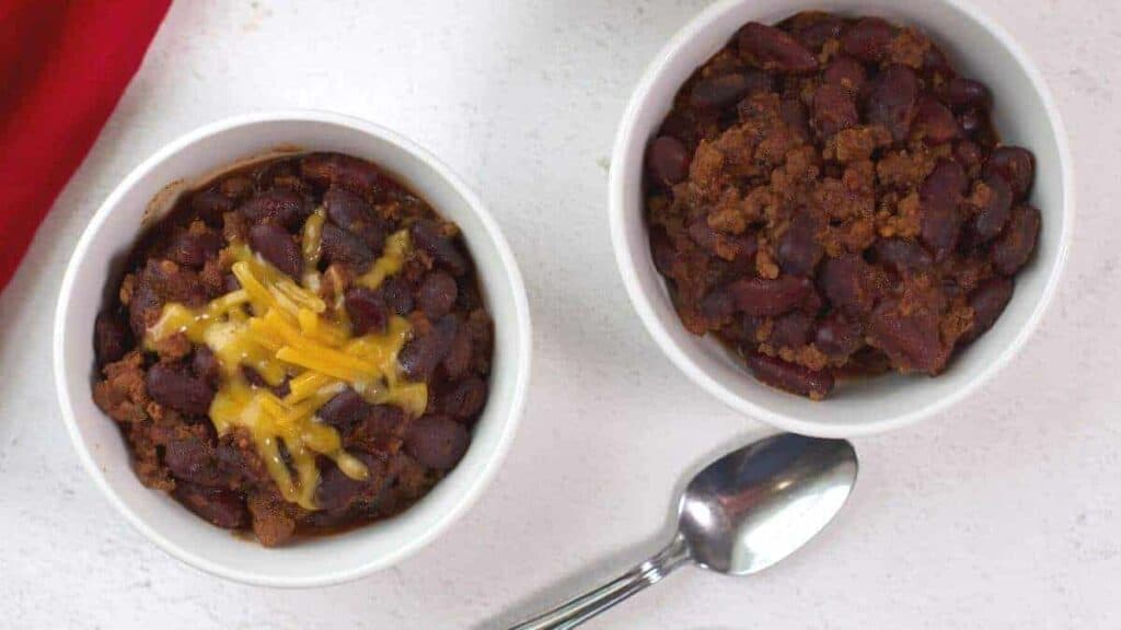 Two cheesy bowls of chili, perfect for a lunch break.