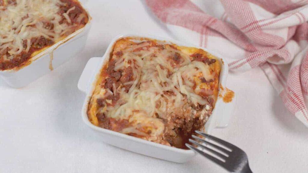Lasagna served on a white dish, perfect for lunch break.