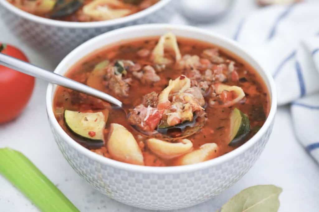 Delicious lunch ideas worth taking a break for - two bowls of hearty soup with meat and vegetables.