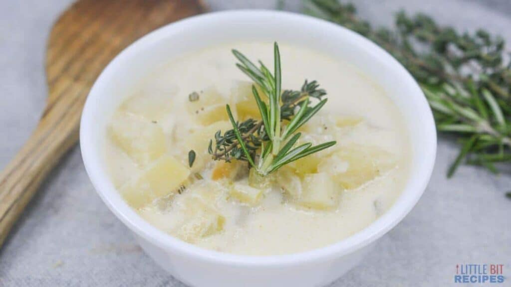 A lunch idea worth taking a break for: a comforting bowl of potato soup with sprigs of rosemary.