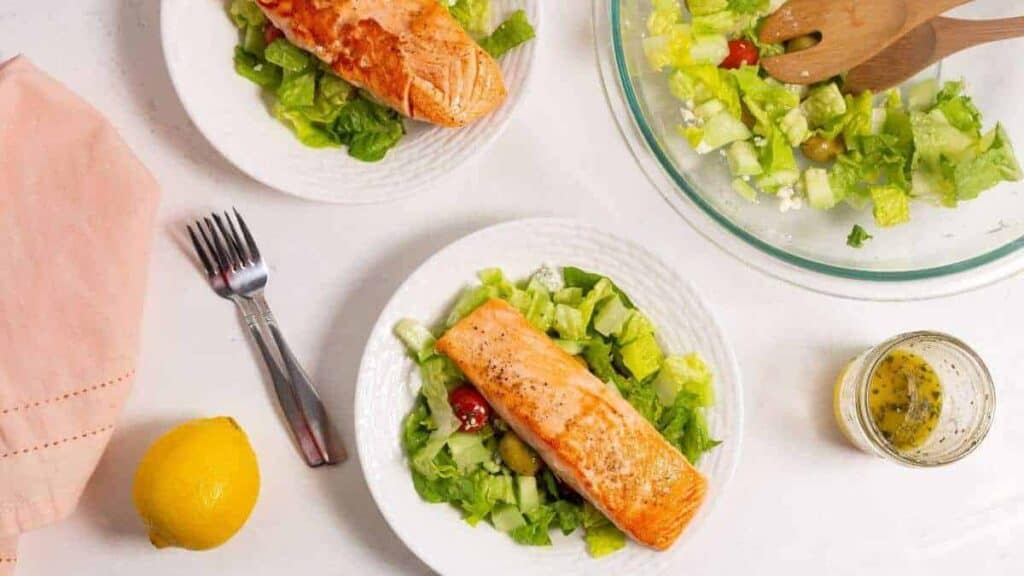 Lunch ideas worth taking a break for: Two plates with salmon and salad on them.