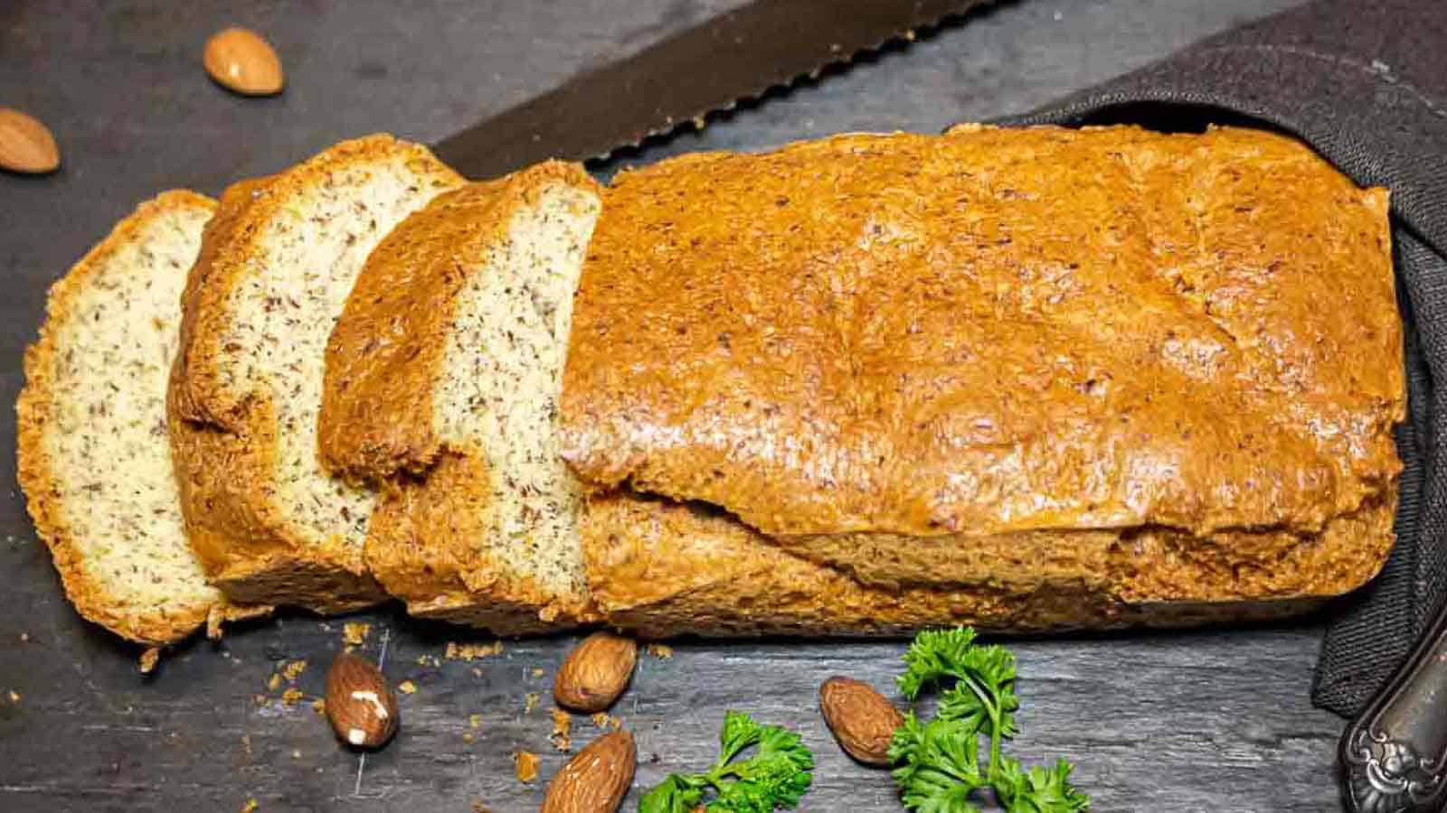 Almond flour bread on a black board sliced.