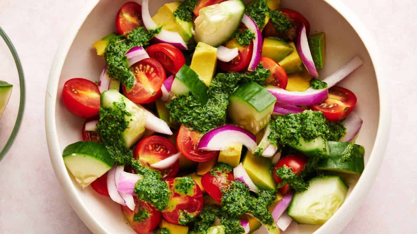 Avocado salad with dressing in a serving bowl.