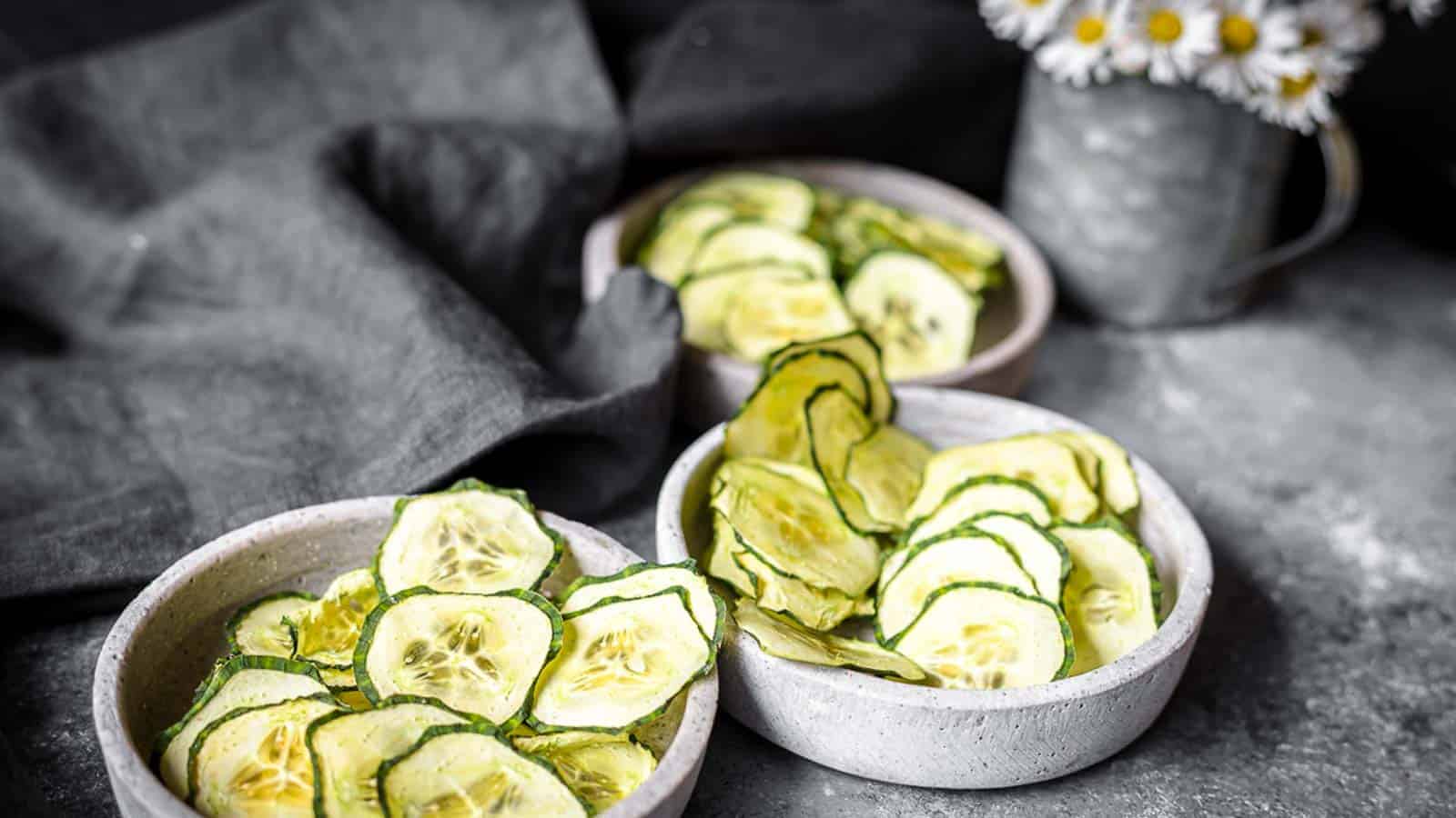 Cucumber Chips inside 3 stone bowls. 