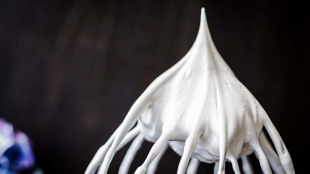 Keto Meringue Frosting on a beater.