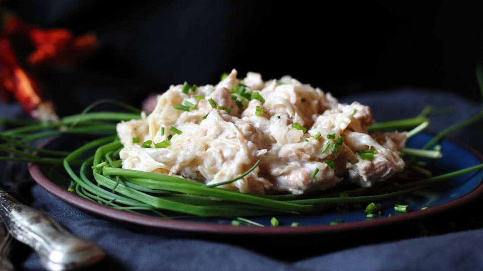 Low Carb Sauerkraut Chicken on a plate with chives.