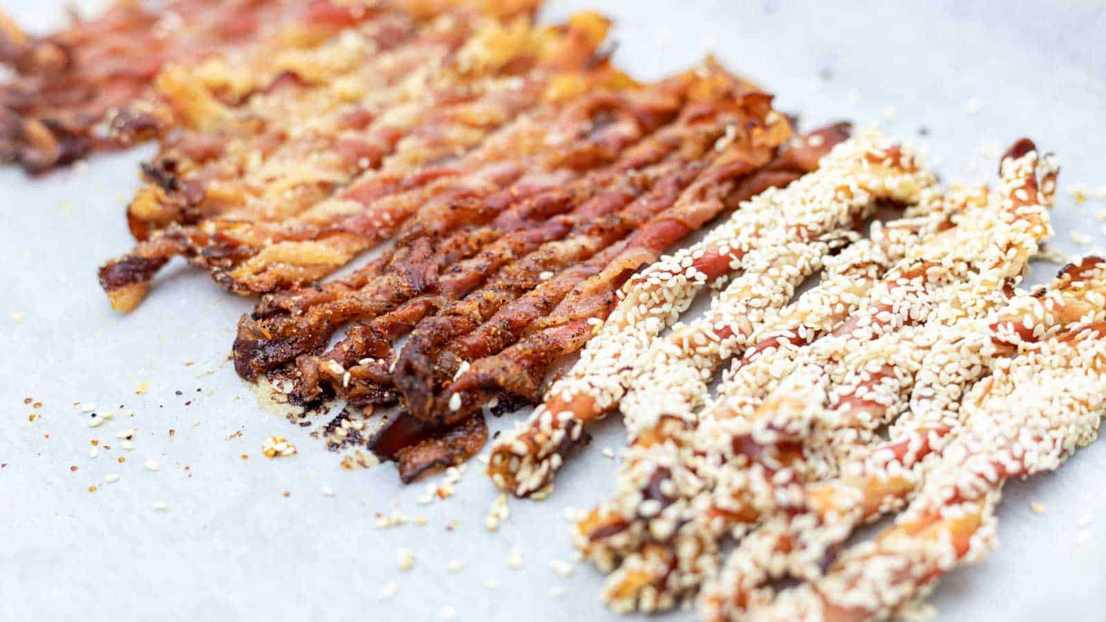 Keto Crispy Twisted Bacon layered on a parchment paper.