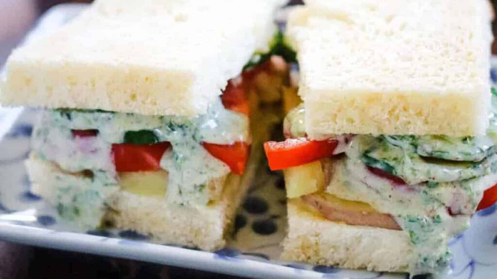 Bombay Sandwiches layered with potato, tomato, cucumbers, and an herb chutney sauce.