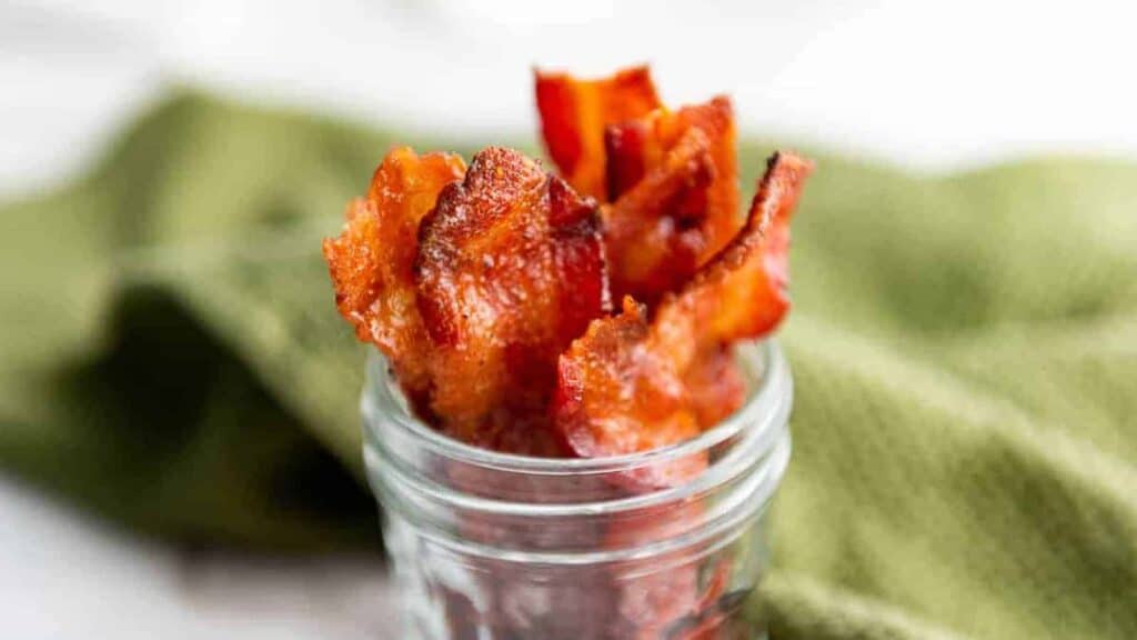 Candied bacon in a canning jar.