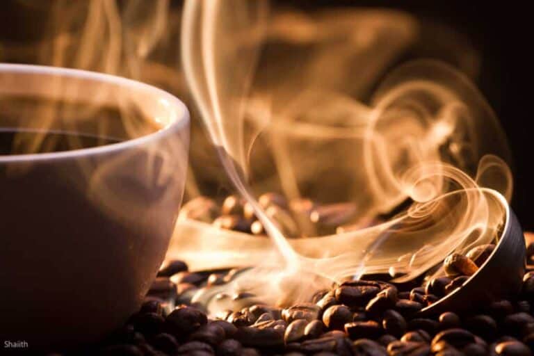 A cup of coffee with smoke coming out of it.