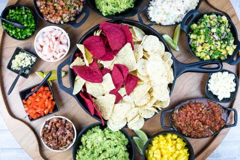 A top-down shot of a guacamole snack board.