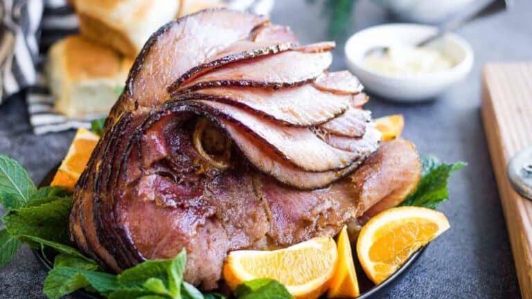 Sliced ham with oranges and mint.