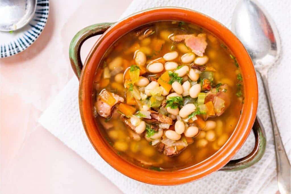 Navy Bean and Ham Soup in a serving crock.