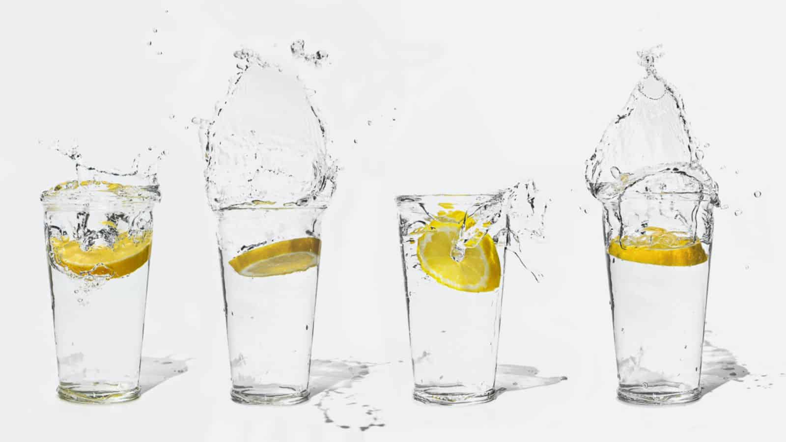 Glasses filled with water and slices of lemons dropped in. 