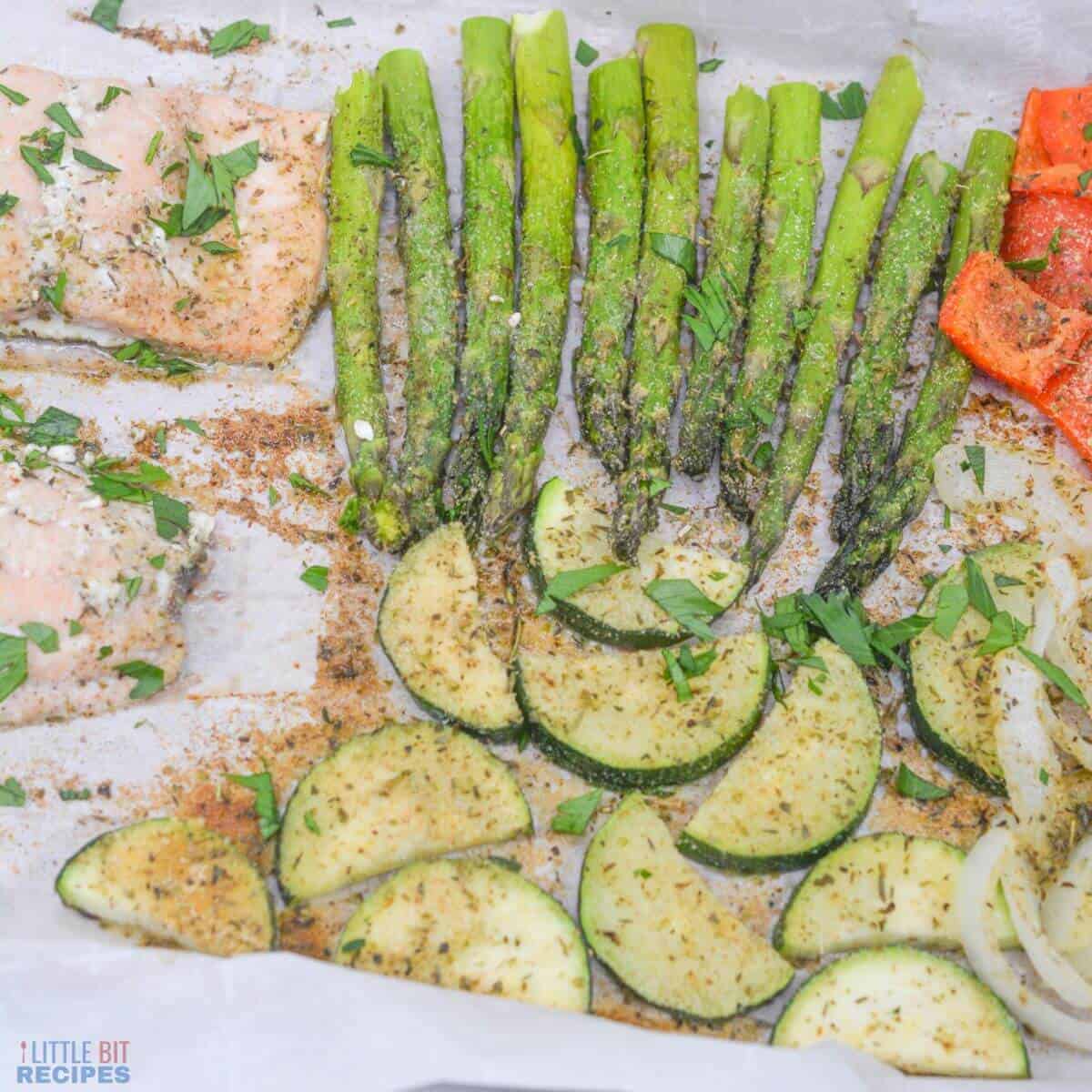 Sheet Pan Salmon and Asparagus on a white plate.
