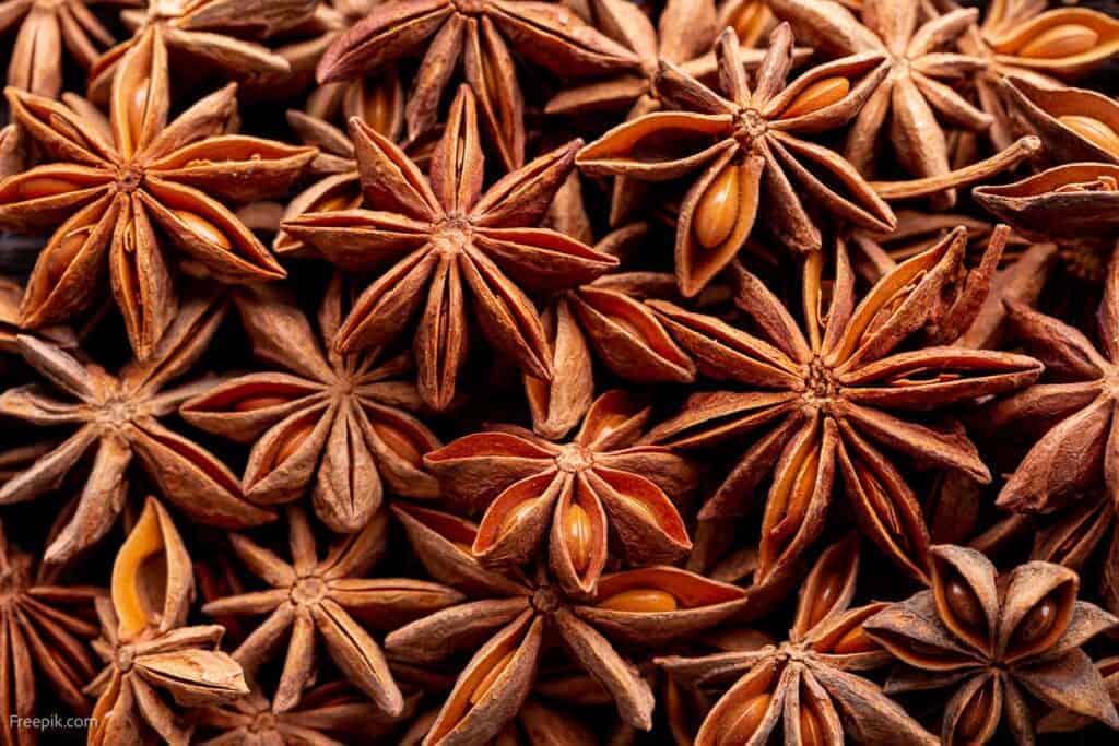 A close up of a pile of dried star anise.