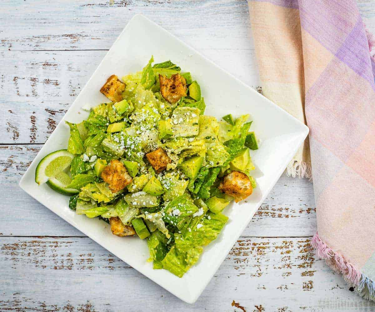 An image of Tex-Mex Caesar Salad on a square plate.