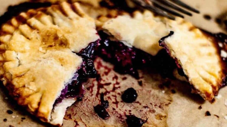 Closeup of a broken open triple berry hand pie.