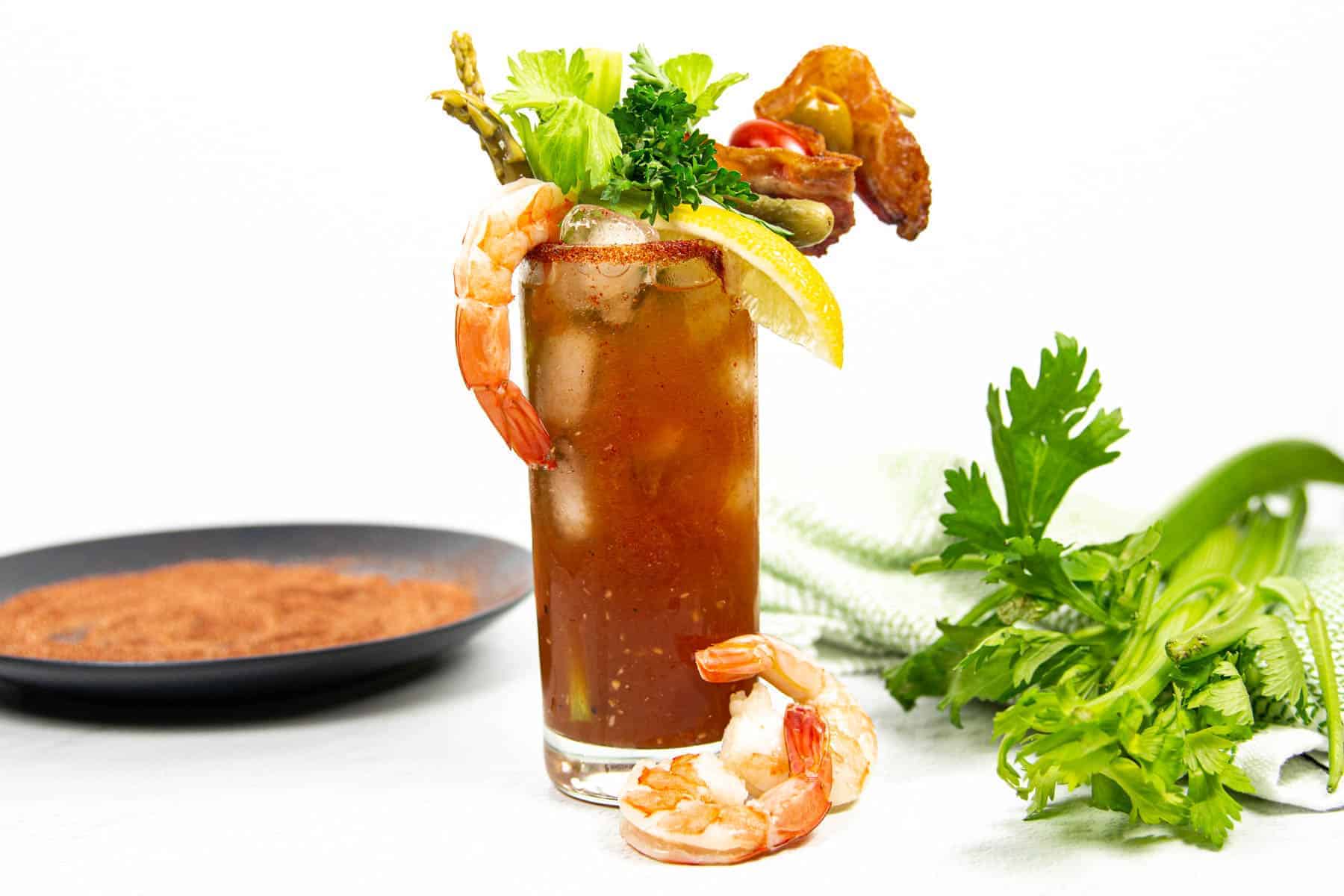 Shrimp, celery and asparagus garnish a new orleans Bloody Mary.