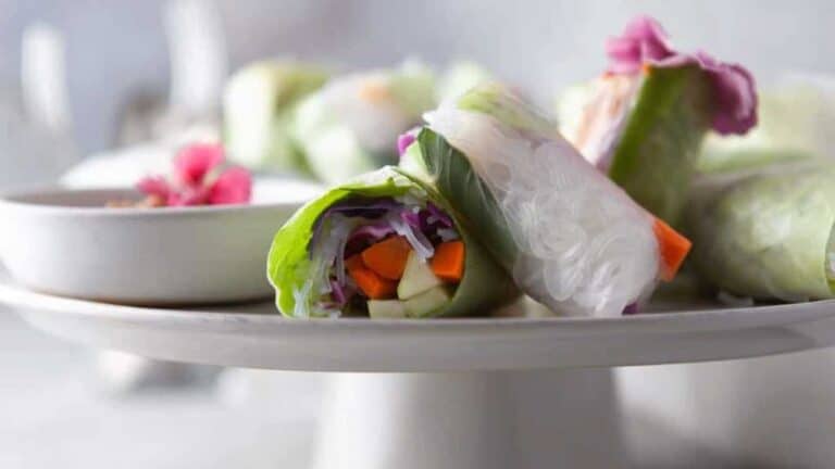 Vietnamese spring rolls on a white plate.