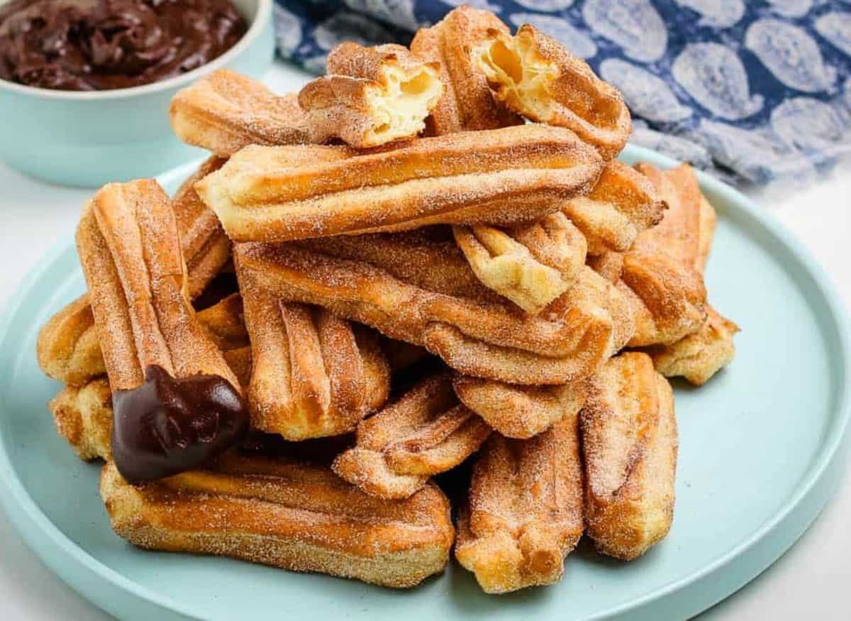Air Fryer Churros dipped in chocolate.