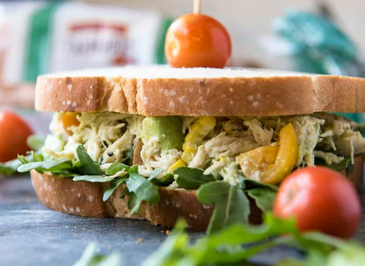 An avocado chicken salad sandwich, a delicious and healthy twist on the classic chicken salad sandwich.