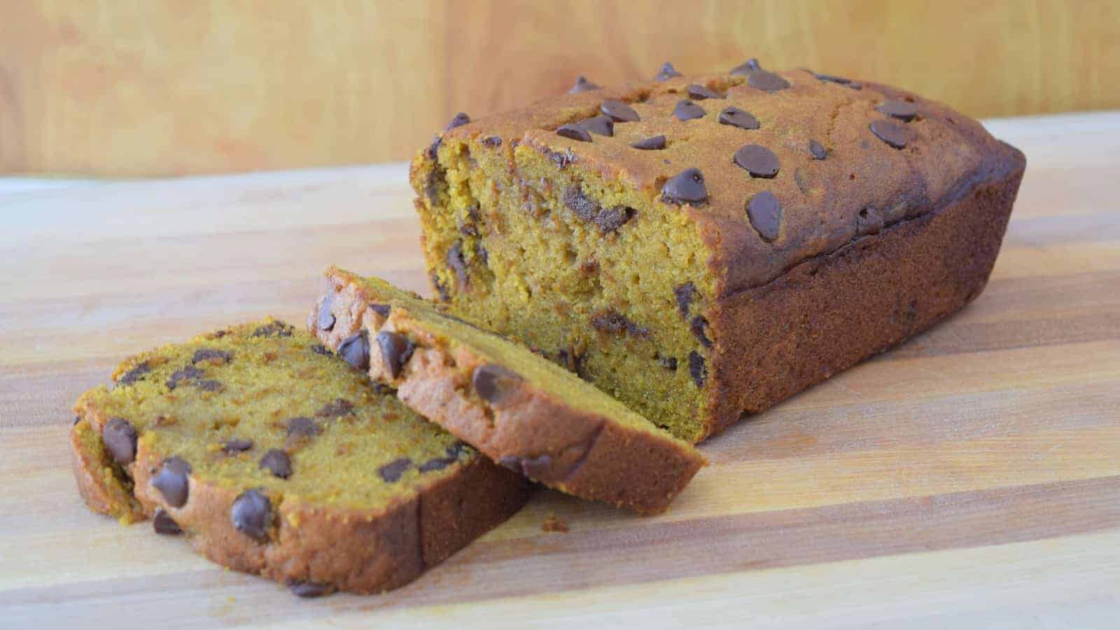 Chocolate Chip Pumpkin Bread sliced on a cutting board.