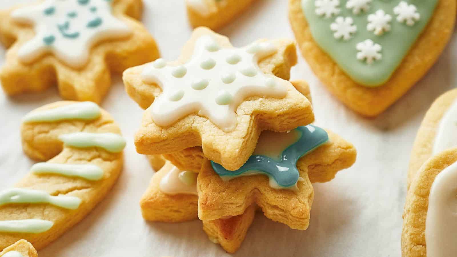 A group of cookies decorated with icing and snowflakes.