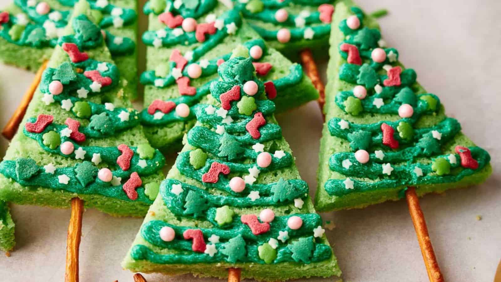 Christmas tree shaped cookies on a baking sheet.