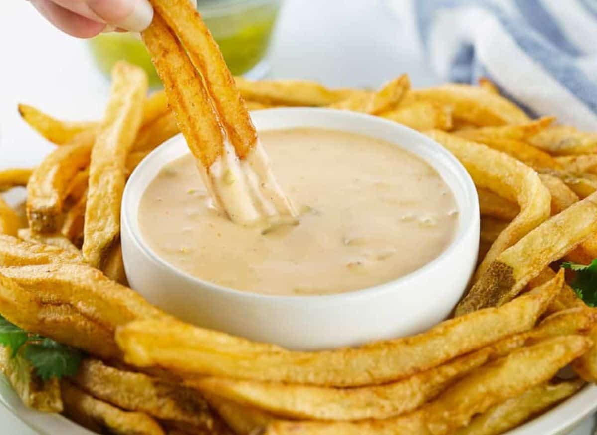 Copycat Animal Sauce in a bowl with fries around it.