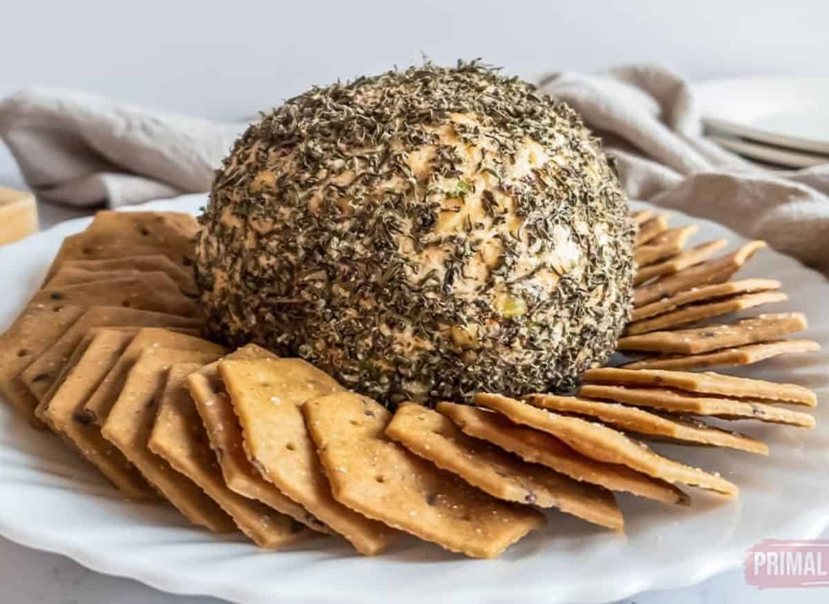 Nut-free cheese ball and crackers on a plate.