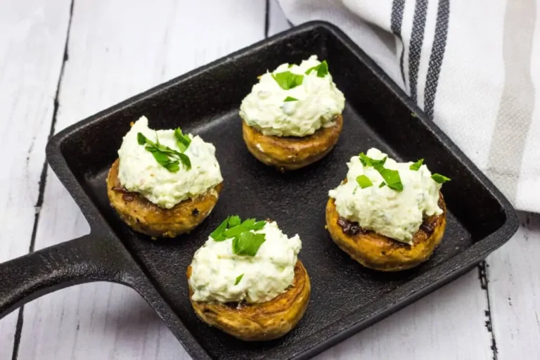 Green Goddess Stuffed Mushrooms in a cast iron pan.