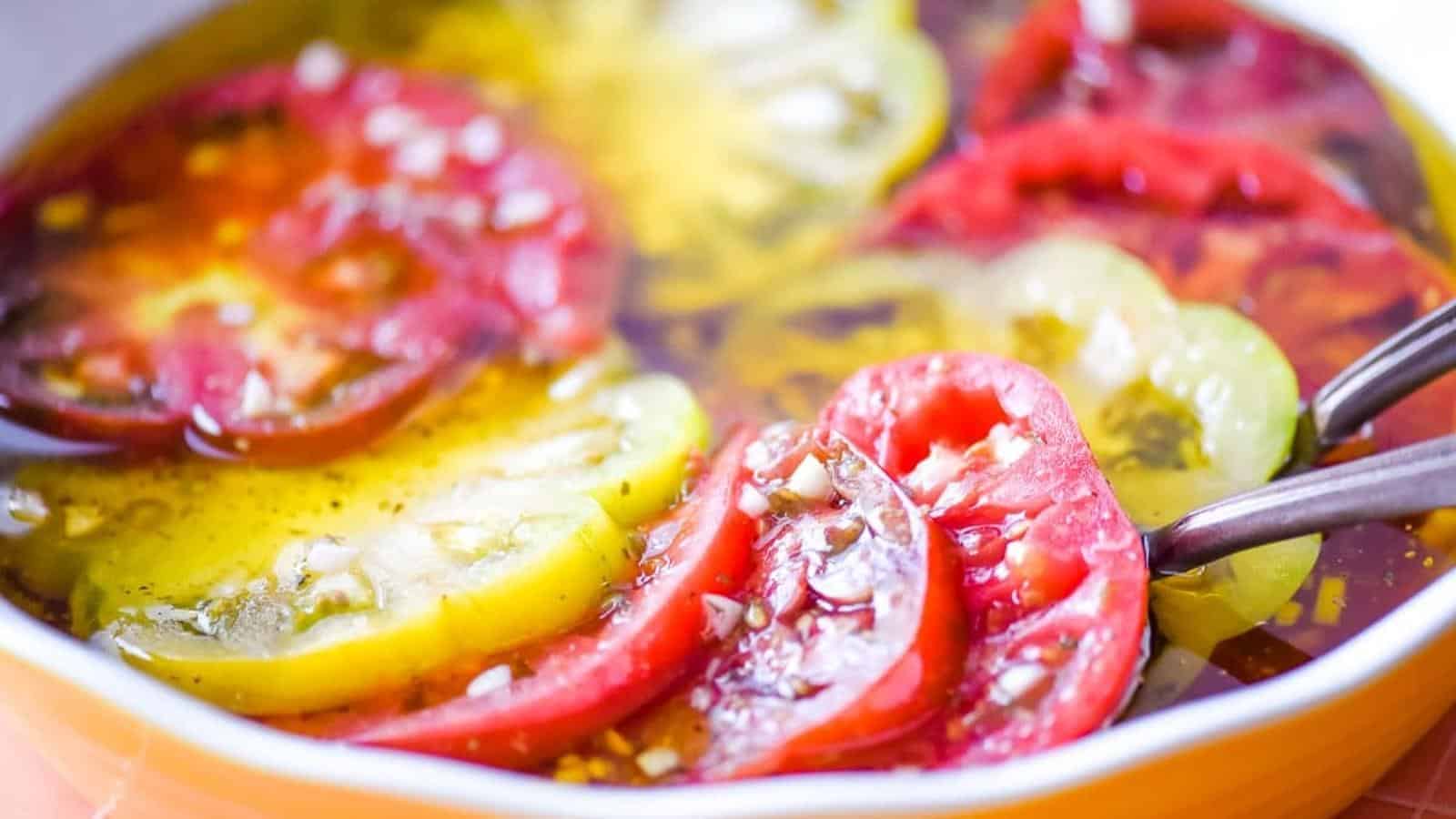 Marinated tomatoes in a dish.