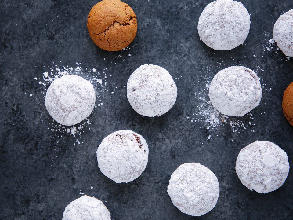 pfeffernusse cookies on grey surface.