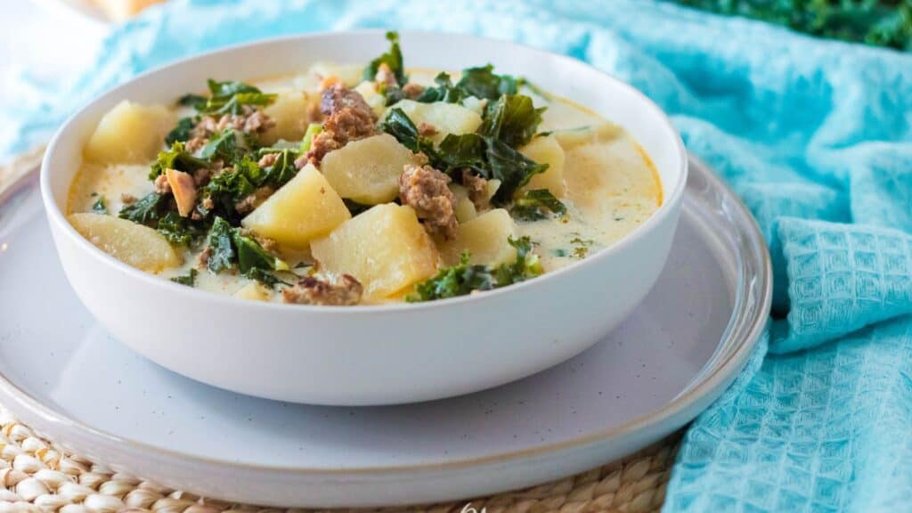 A Slow Cooker Zuppa Toscana with potatoes and kale.