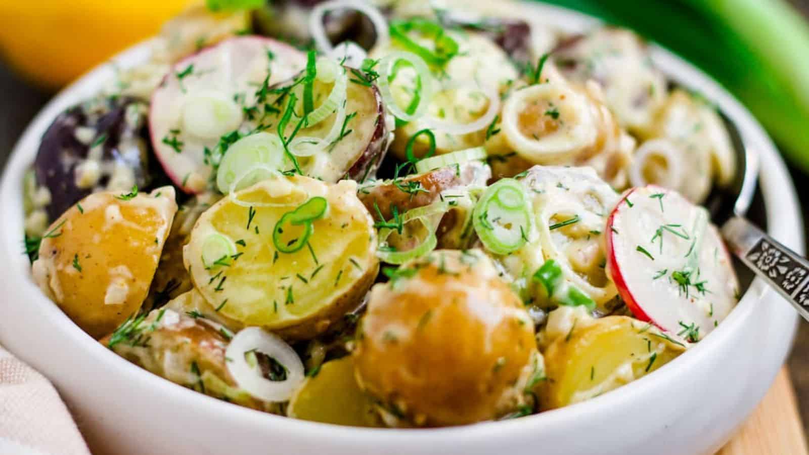 A bowl of spring onion potato salad.