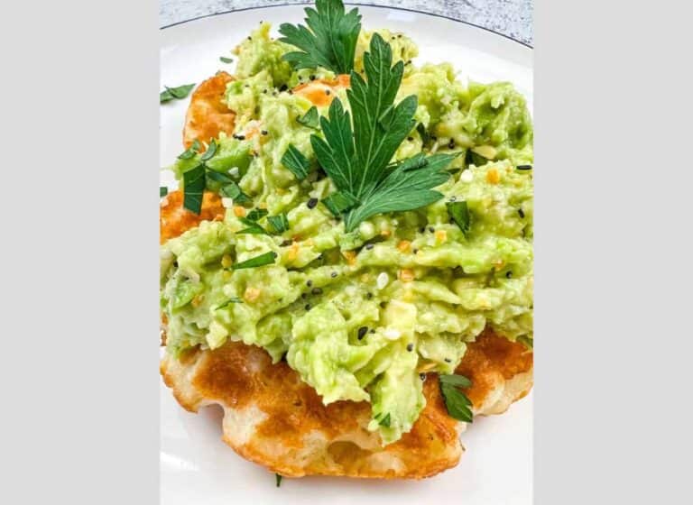 A plate with guacamole on it.