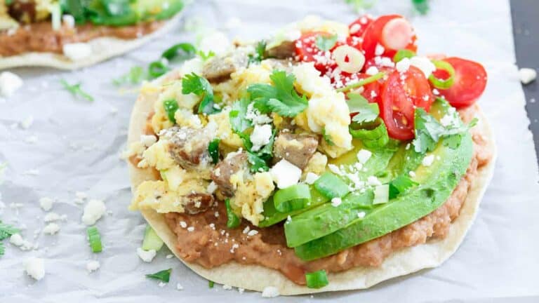 Mexican breakfast tacos on a baking sheet.