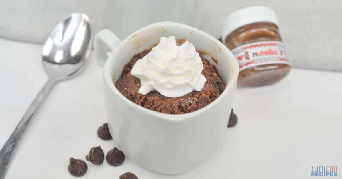 Nutella mug cake with whipped cream.