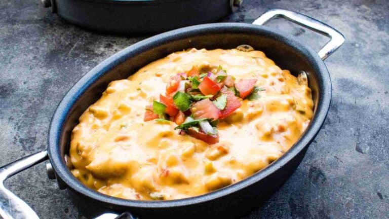 Cheesy macaroni and cheese in a black pot.