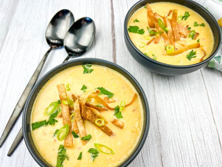 Two flavorful soups with tortilla chips on top.